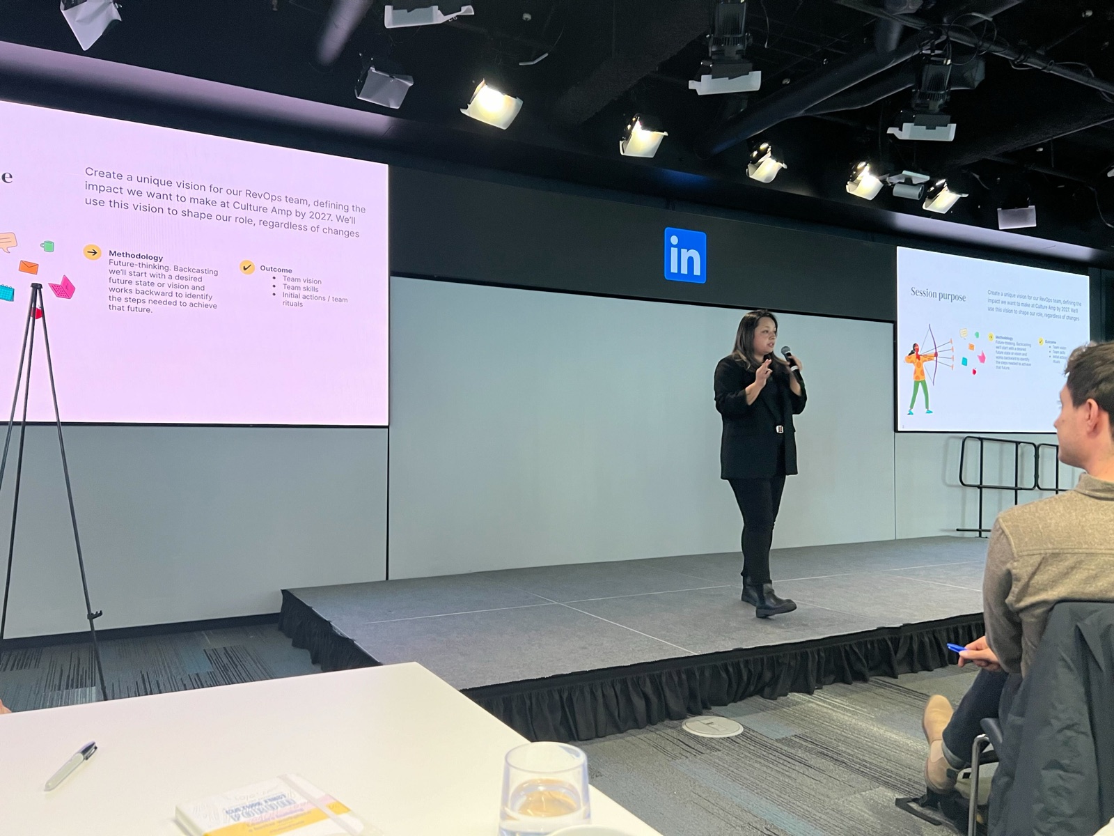 Nati presenting on stage at Culture Amp